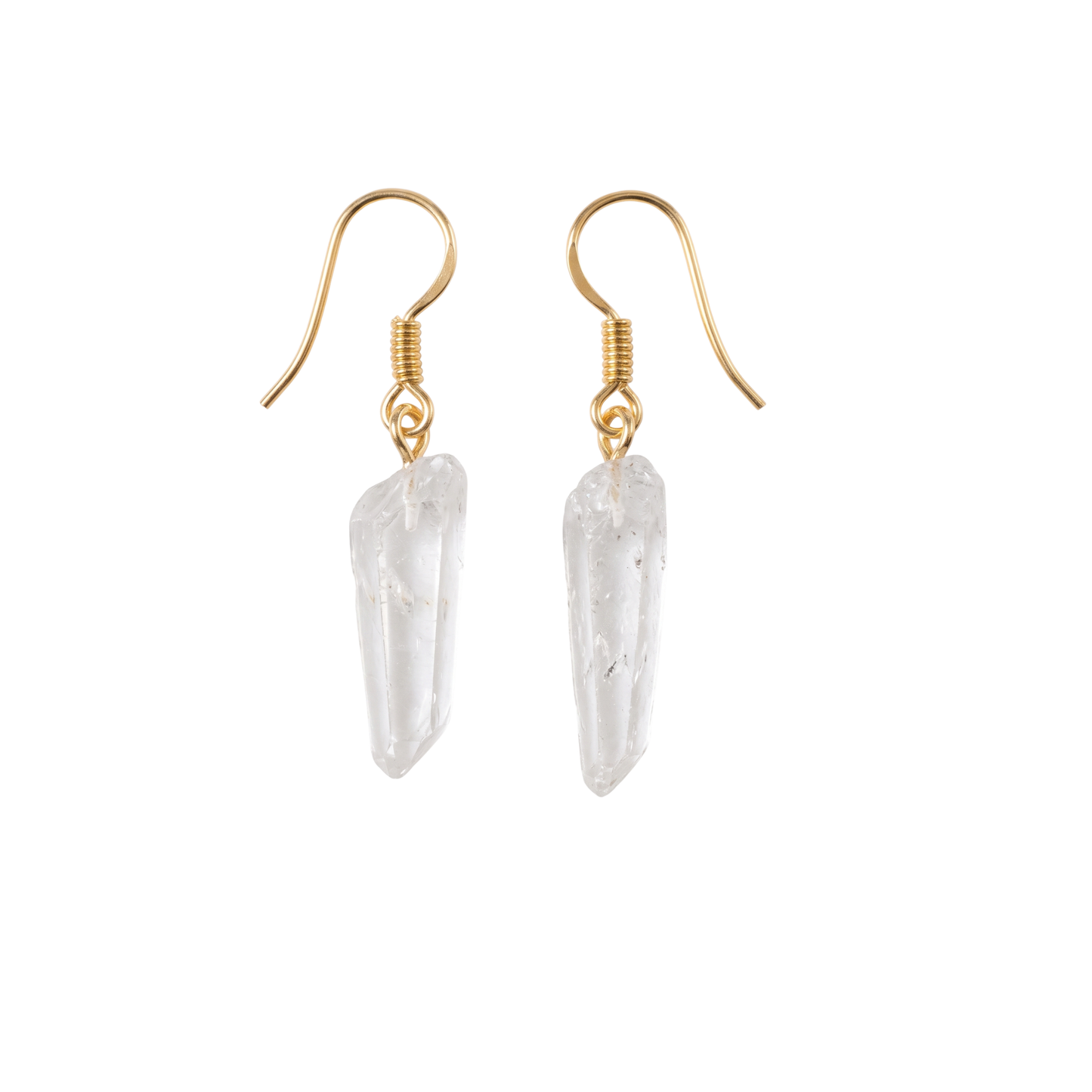 Pair of natural clear quartz point dangle earrings with silver-plated classic fishhook wires on a clean light background. Raw crystal jewelry.